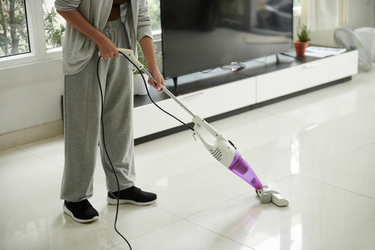 vacuuming tile floor